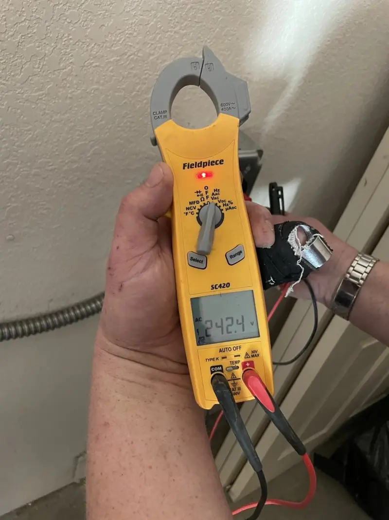 Voltage testing with clamp meter during Hot Tub / Pool Electrical Wiring in The Village
